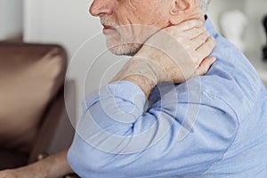Mature aged man with neck pain, feeling sick