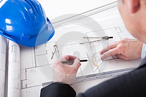 Mature Architect Male Working At The Desk