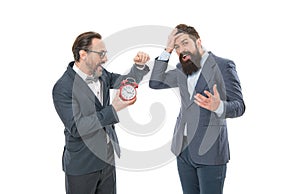 mature bearded men in formal suit hold alarm clock. deadline. late again. angry and exhausted businessmen. bad morning