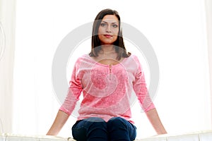 Mature beautiful pensive woman sitting