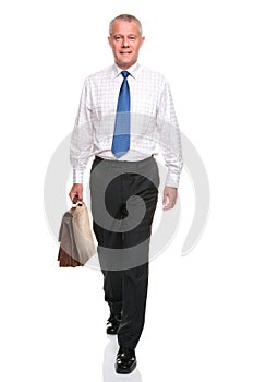 Mature businesman walking towards