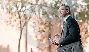 Mature business man, city and building, glasses and cellphone with coffee and bag in street on bokeh background