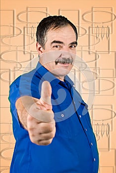 Mature business man giving thumbs up