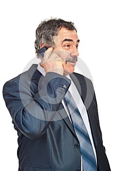 Mature business man talking by phone mobile