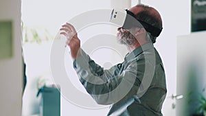 Mature business man wearing virtual reality googles / VR Glasses