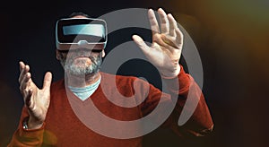 Mature business man wearing virtual reality googles / VR Glasses