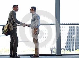 Mature business people, handshake or partnership deal in airport lounge, hotel lobby or modern office for financial crm