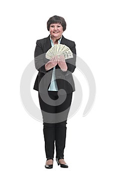 Mature business woman with a bundle of banknotes