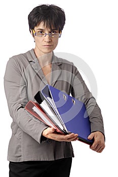 Mature business woman looking over her glasses