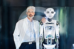 Mature businessman or a scientist with robot.