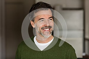 Mature Businessman Smiling and Looking Away. Isolated On the kitchen