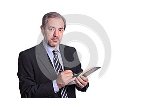 Mature businessman taking notes