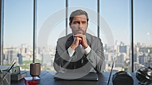 Mature businessman thinking ideas at cityscape view. Worried man working office