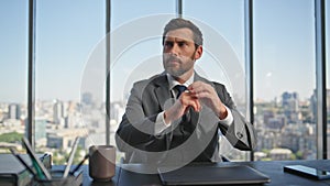 Mature businessman thinking ideas at cityscape view. Worried man working office