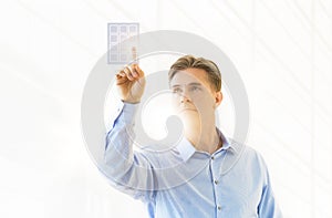 Mature Businessman Touching Virtual Keypad