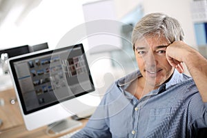 Mature businessman working on computer