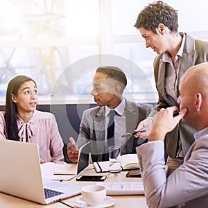 Mature businesswoman conducting a presentation in modern board room