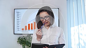 Mature Businesswoman with Digital Tablet in Office