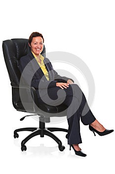 Mature businesswoman sat in leather chair