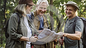 Mature campers checking for direction