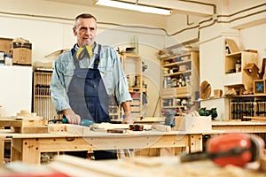 Mature Carpenter in Workshop