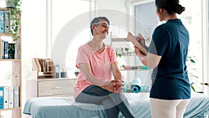 Mature, checklist or woman in consultation for physiotherapy with results, news or clipboard. Rehabilitation, smile or