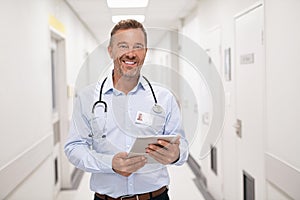Mature confident doctor at hospital