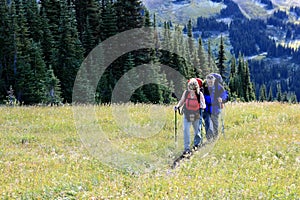 Mature Couple Backpacking Through Singing Pass