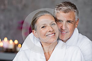 Mature couple in bathrobe at spa photo