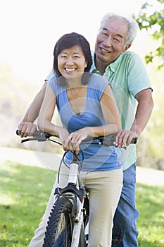 Mature couple bike riding.