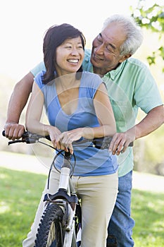 Mature couple bike riding.