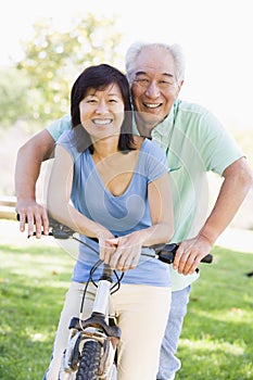 Mature couple bike riding.