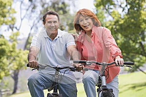 Mature couple bike riding.