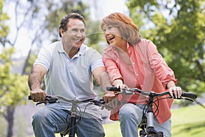 Mature couple bike riding.