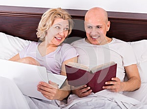 Mature couple burring with laptop