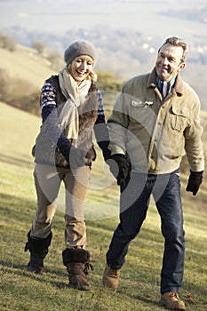 Mature couple on country walk in winter