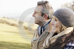 Mature couple on country walk in winter