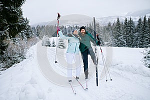 Mature couple cross country skiing outdoors in winter nature, Tatra mountains Slovakia.