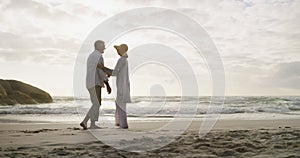 Mature couple, dancing or laugh by beach in nature, care support for fun on weekend adventure. Senior man, woman and