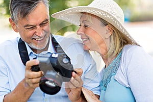 Mature couple with digital camera