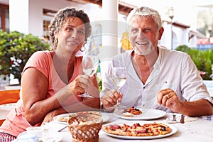 Mature Couple Eating Meal Outdoors Together