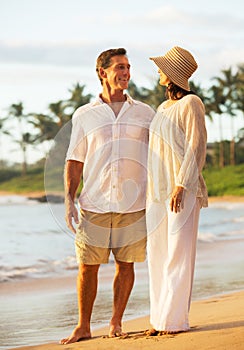 Mature Couple Enjoying Sunset on the Beach