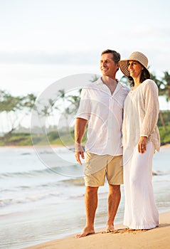 Mature Couple Enjoying Sunset on the Beach