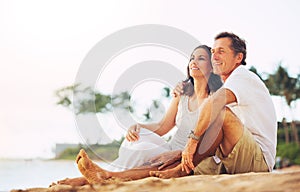 Mature Couple Enjoying Sunset on the Beach