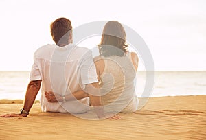 Mature Couple Enjoying Sunset on the Beach