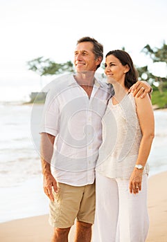 Mature Couple Enjoying Sunset on the Beach