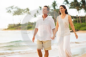 Mature Couple Enjoying Walk on the Beach