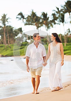 Mature Couple Enjoying Walk on the Beach