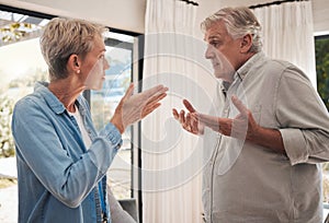 Mature couple fight, divorce and conflict problem in conversation with anger, blame and stress at home. Angry woman
