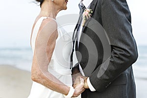 Mature couple getting married at the beach